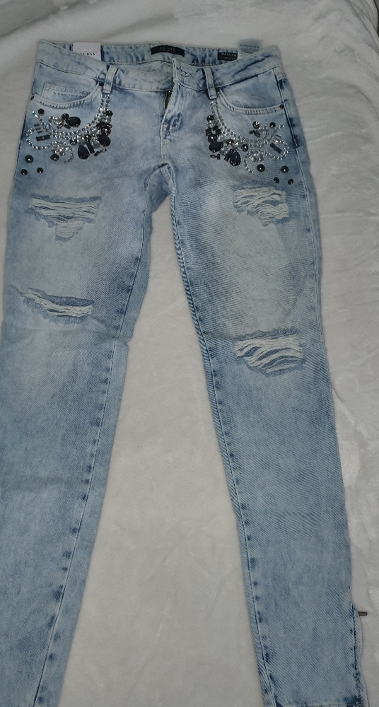 Guess jeans with jewelry.